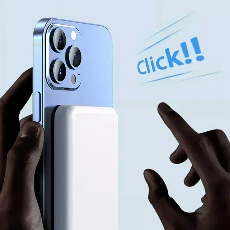 Power bank charging a phone wirelessly, held in one hand